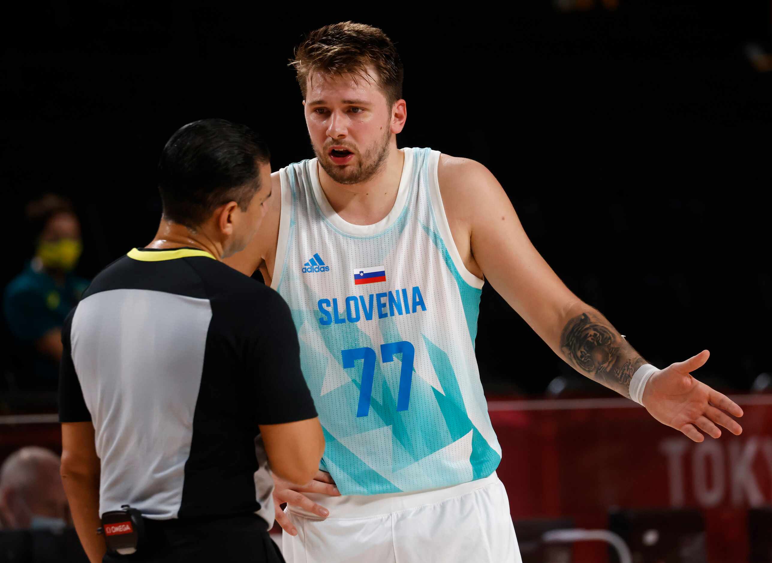 Slovenia’s Luka Doncic (77) questions an official after a play in a game against Australia...