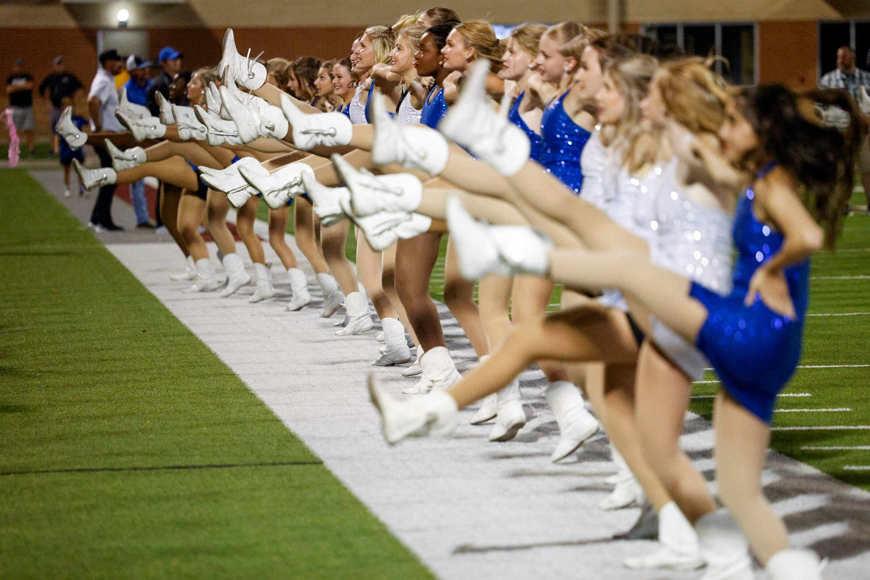 The Trophy Club Byron Nelson Bobcat Dazzlers dance team kick for every point scored after a...