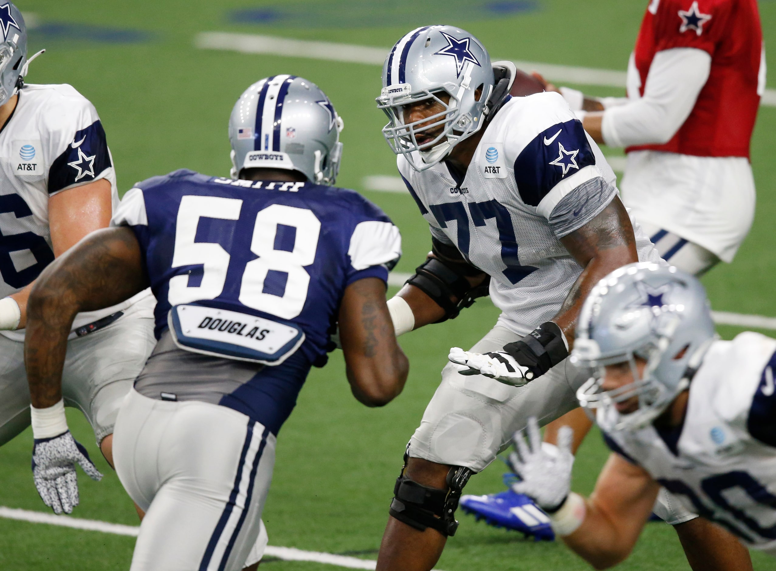 Dallas Cowboys offensive tackle Tyron Smith (77) looks to block Dallas Cowboys defensive end...