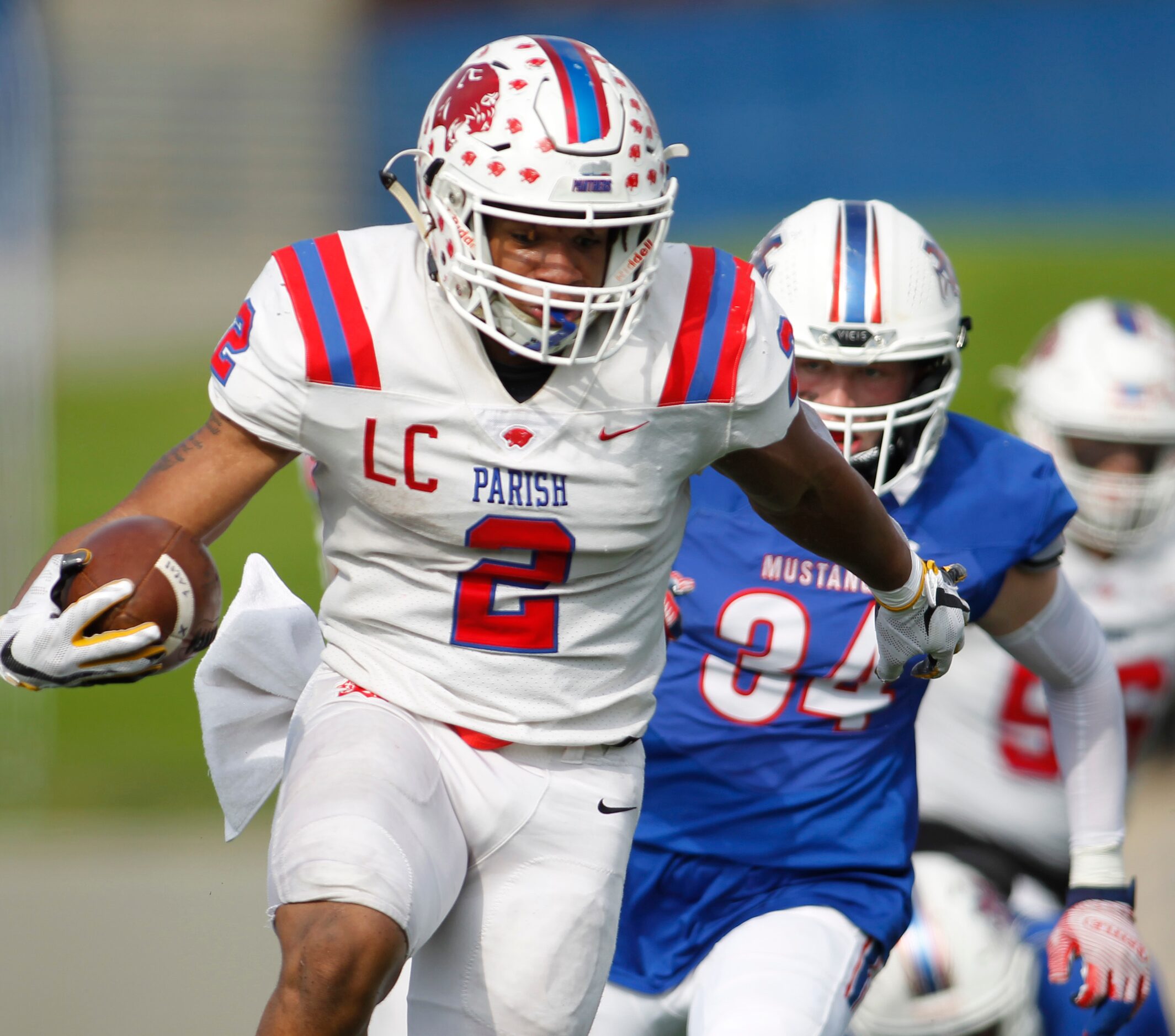 Parish Episcopal running back Andrew Paul (2) sprints away from the pursuit of Midland...