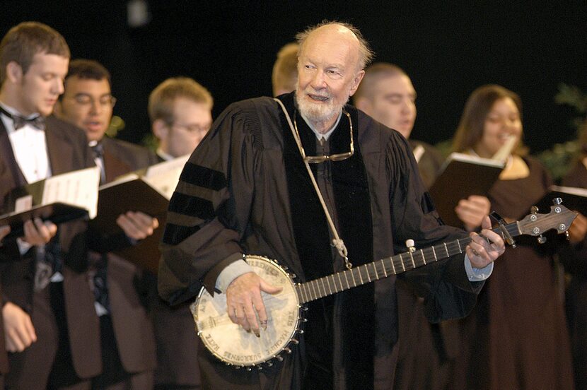 File-This May 10, 2003 file photo shows folk singer Pete Seeger performing"When the Saints...