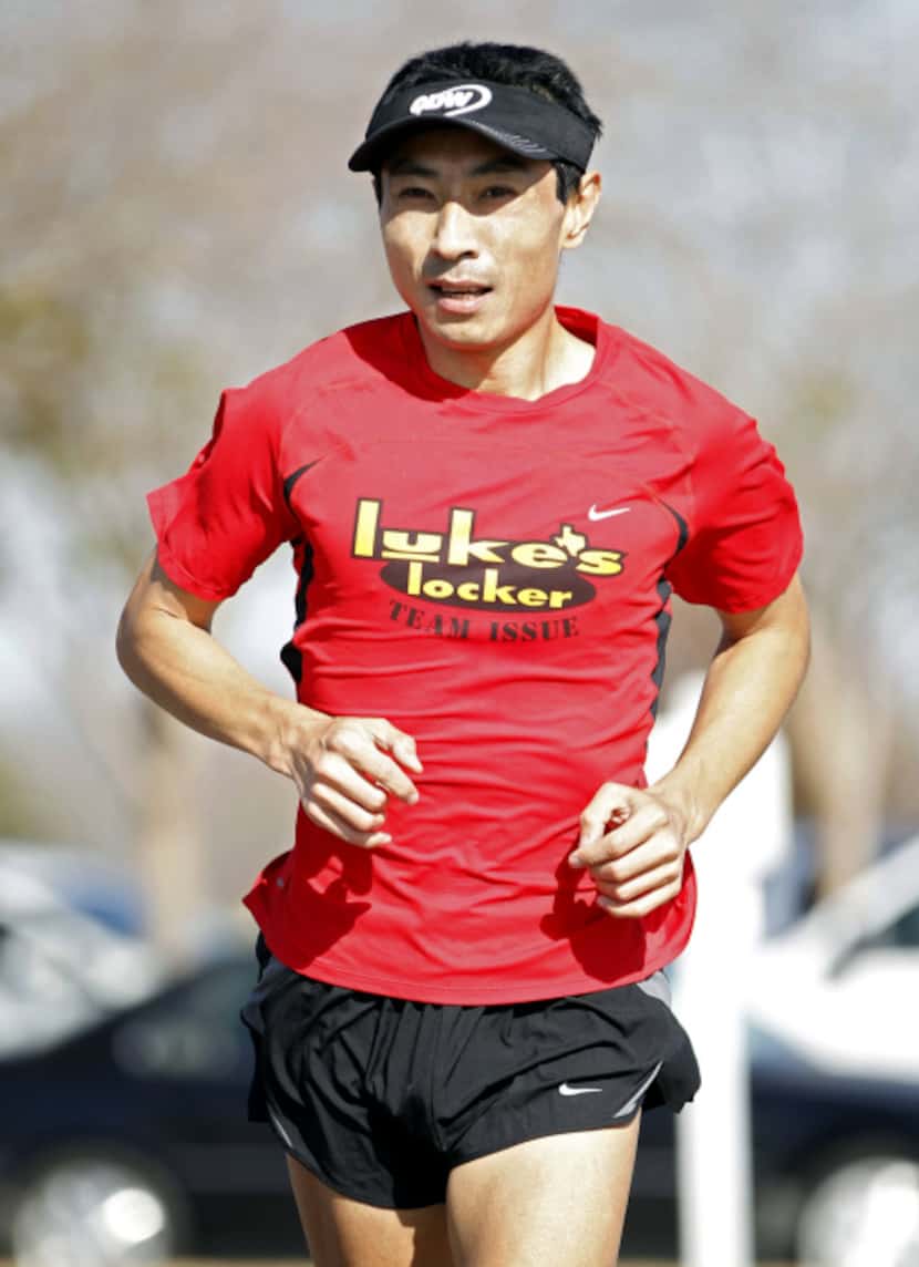 Kim Mang laces up his running shoes and hits the road during his lunch break at a Wylie’s...