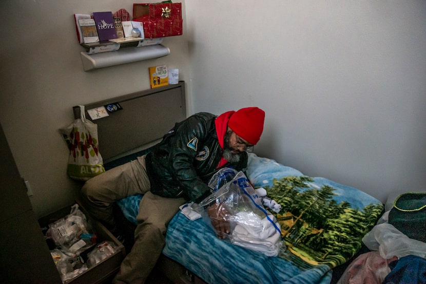 Randy organized a bag of socks on his bed to give to a friend who was also living at The...