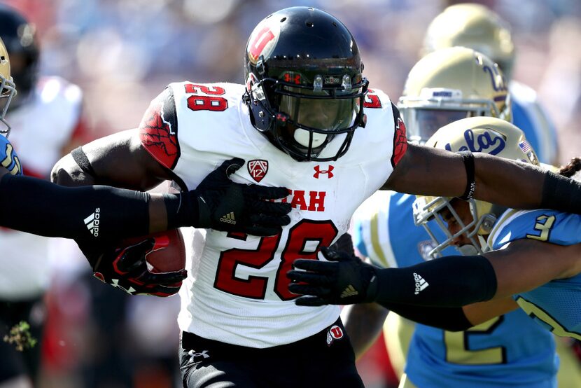 PASADENA, CA - OCTOBER 22:  Joe Williams #28 of the Utah Utes runs the ball during the first...