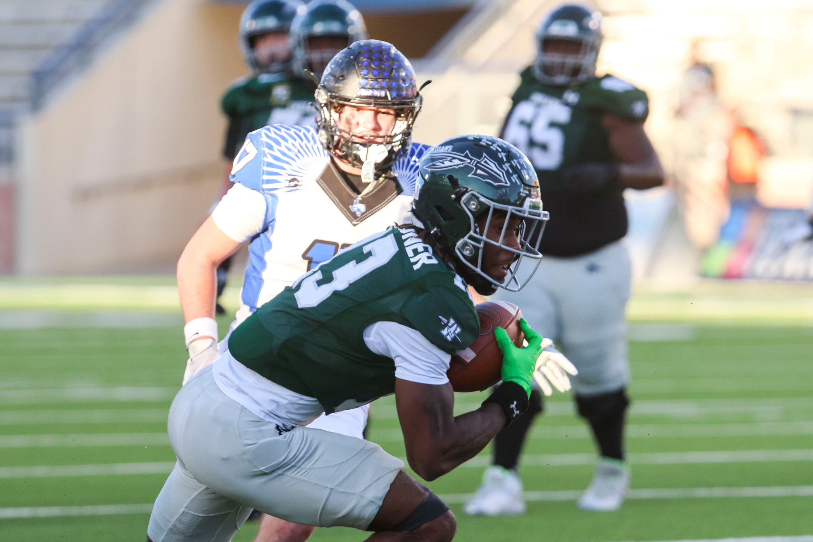 Waxahachie High’s Tristian Gardner (13) receives a pass as North Forney High’s Staten...