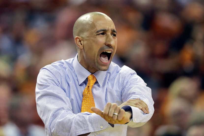 Texas head coach Shaka Smart argues a call during the second half of an NCAA college...