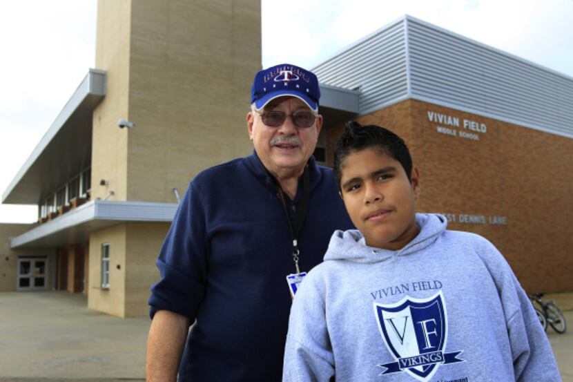 Pete Cross mentors eighth-grader Jacob Guerrero at  Vivian Field Middle School in Farmers...