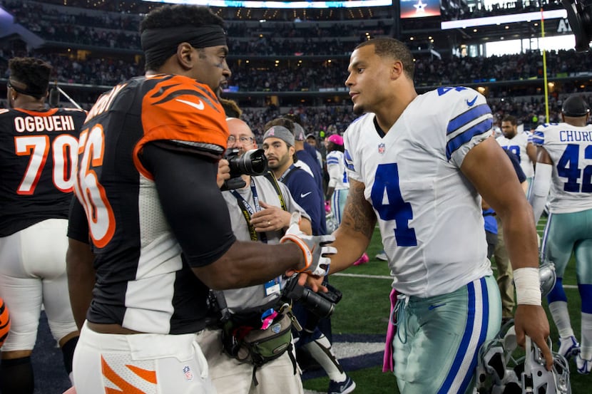 Dallas Cowboys quarterback Dak Prescott (4) shakes hands with Cincinnati Bengals outside...