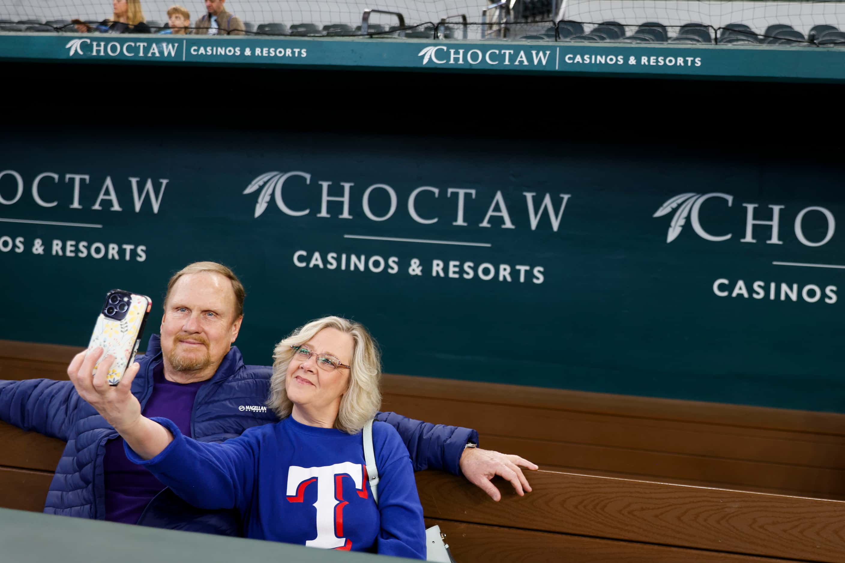 Cindy McCoy (right) takes a selfie with Randy Laster of Ft. Worth while sitting in the...