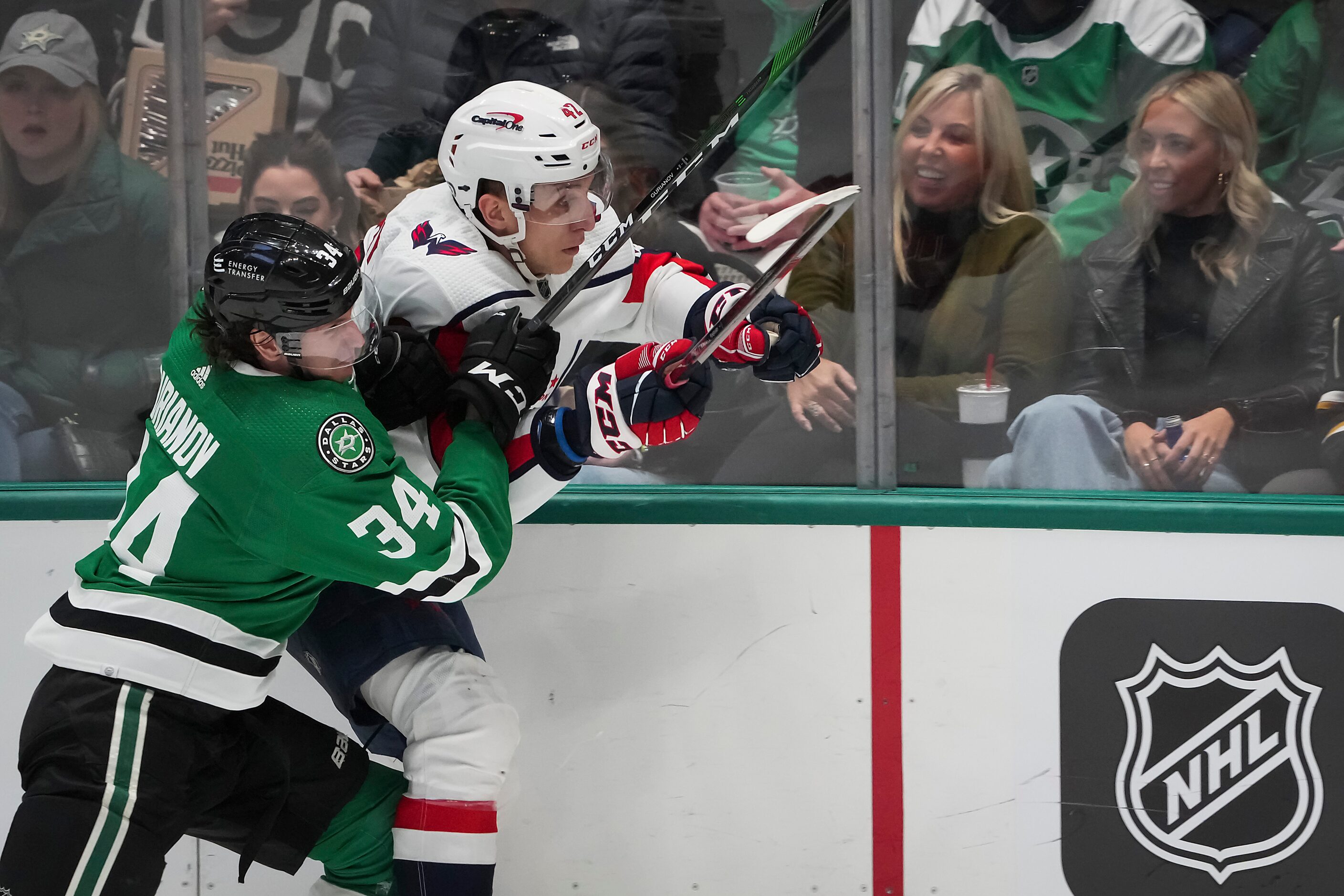 Washington Capitals defenseman Martin Fehervary (42) is checked by Dallas Stars right wing...