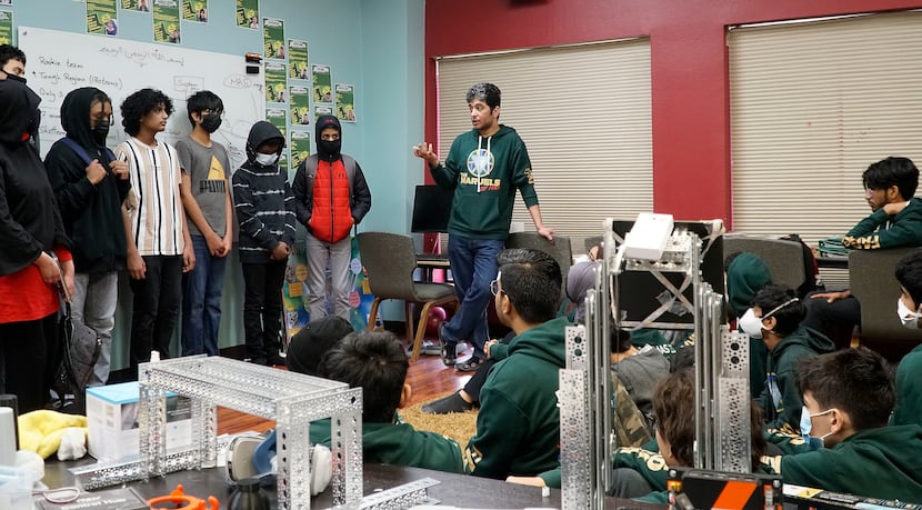 Mohamed Ebeida (center) speaks to the Marvels of MAS and Marvels of Irving robotics teams...