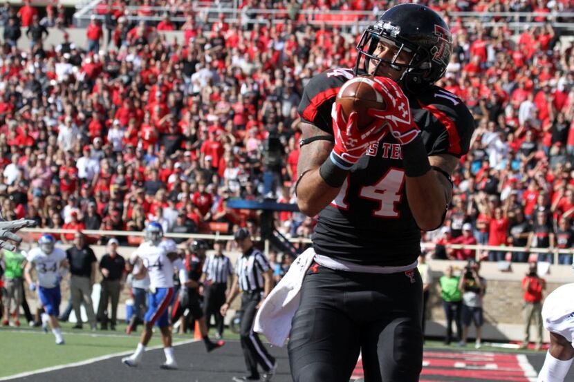 Nov 10, 2012; Lubbock, TX, USA; Texas Tech Red Raiders wide receiver Darrin Moore (14)...