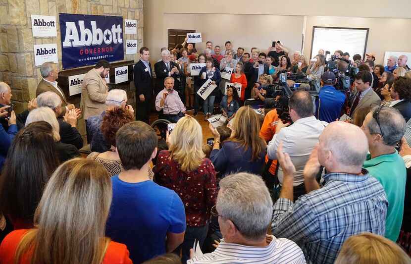 Governor Greg Abbott speaks to a small crowd of supporters at the Castle Hills Community...