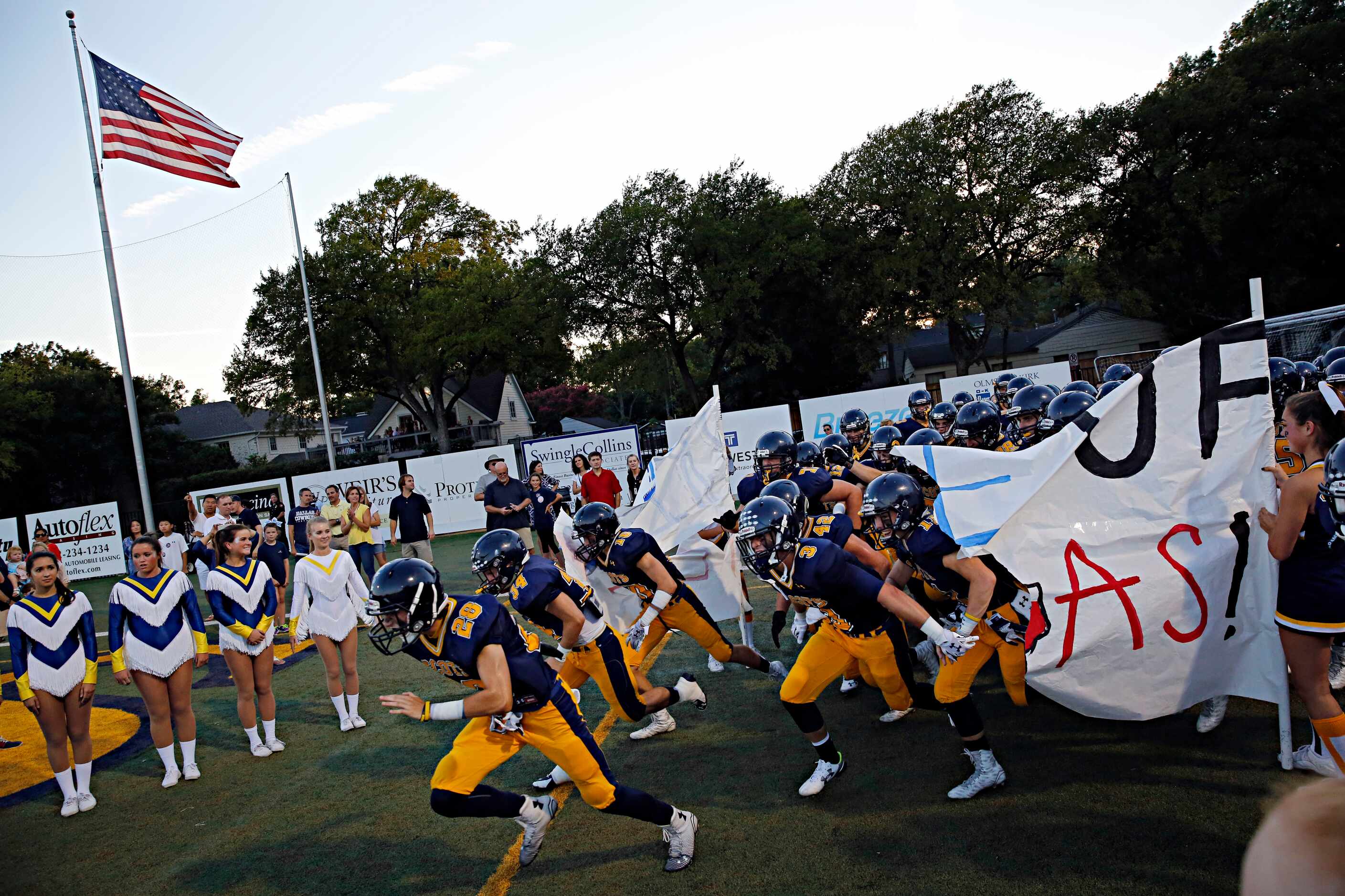 Highland Park Scots players take to the field before their game against Pulaski Friday,...