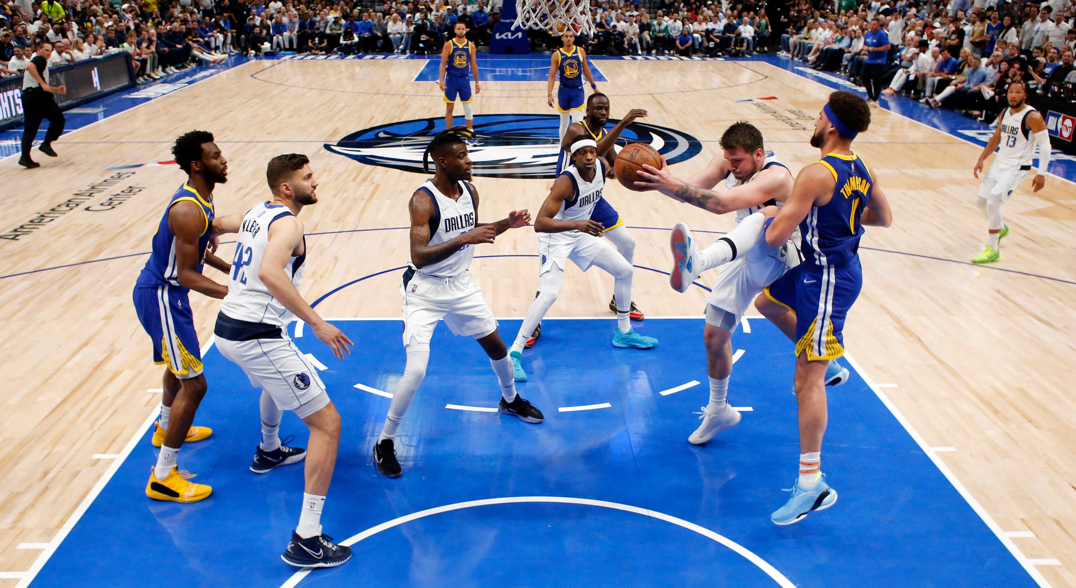 Dallas Mavericks guard Luka Doncic (77) pulls down a defensive rebound in the second half in...