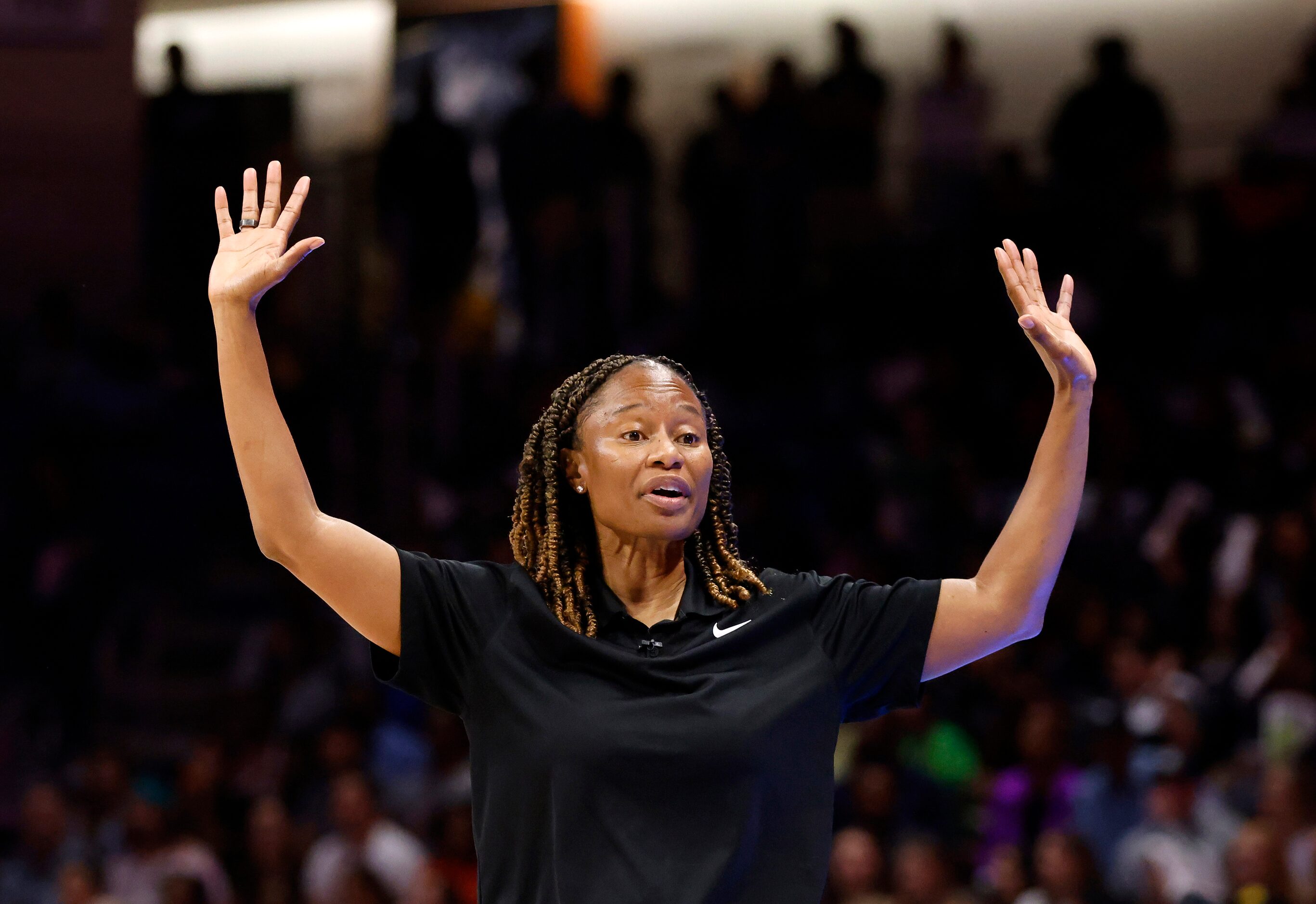 Dallas Wings head coach Vickie Johnson signals to her players during the first half of the...