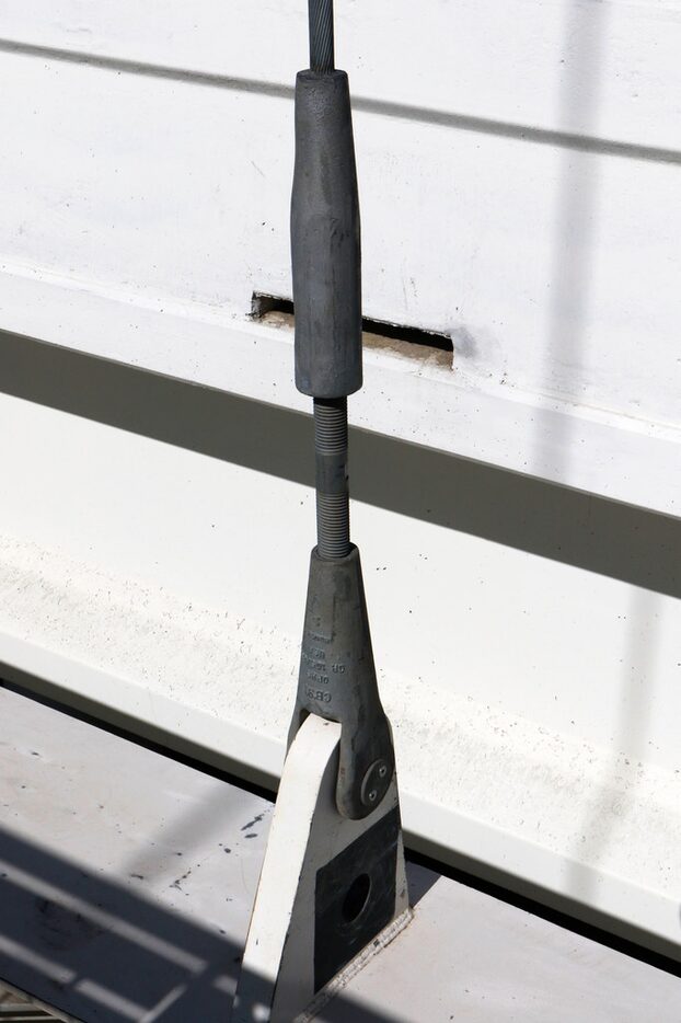 Cables and rods attached near the pedestrian and bike lane of the Margaret McDermott bridge