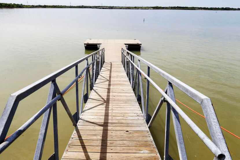
In October, one of the docks at East Fork Park at Lavon Lake sat on dry land. The lake,...