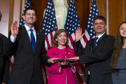 House Speaker Paul Ryan administers the House oath of office to Rep. Filemon Vela Jr.,...