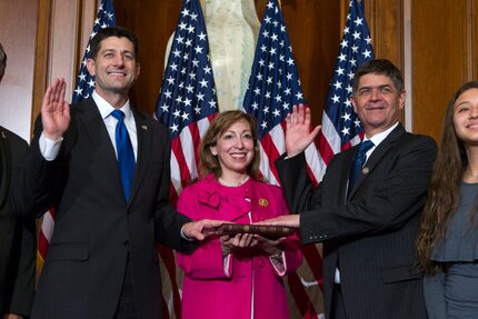 House Speaker Paul Ryan administers the House oath of office to Rep. Filemon Vela Jr.,...