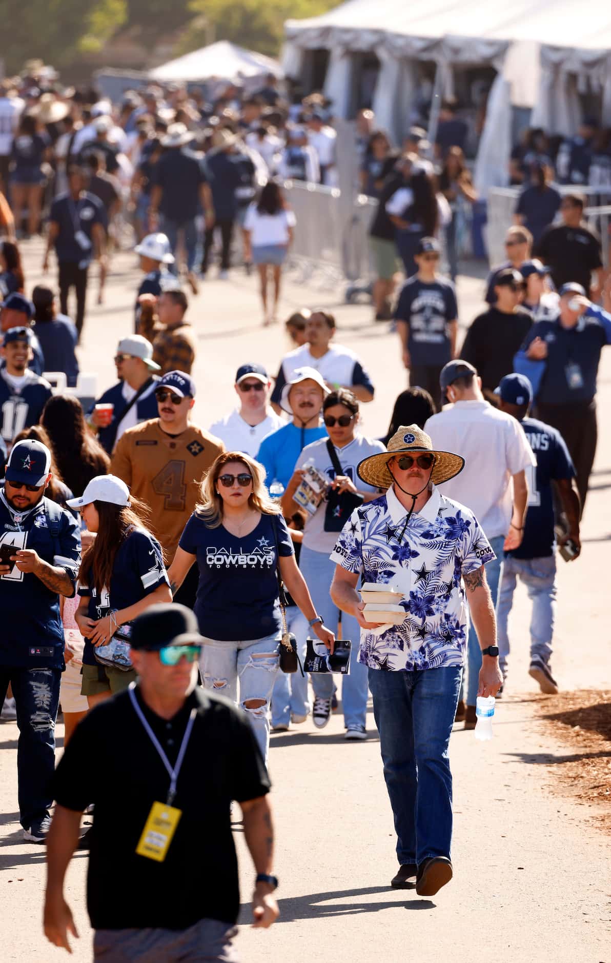 Dallas Cowboys fans arrive for a training camp practice in Oxnard, California, July 27,...