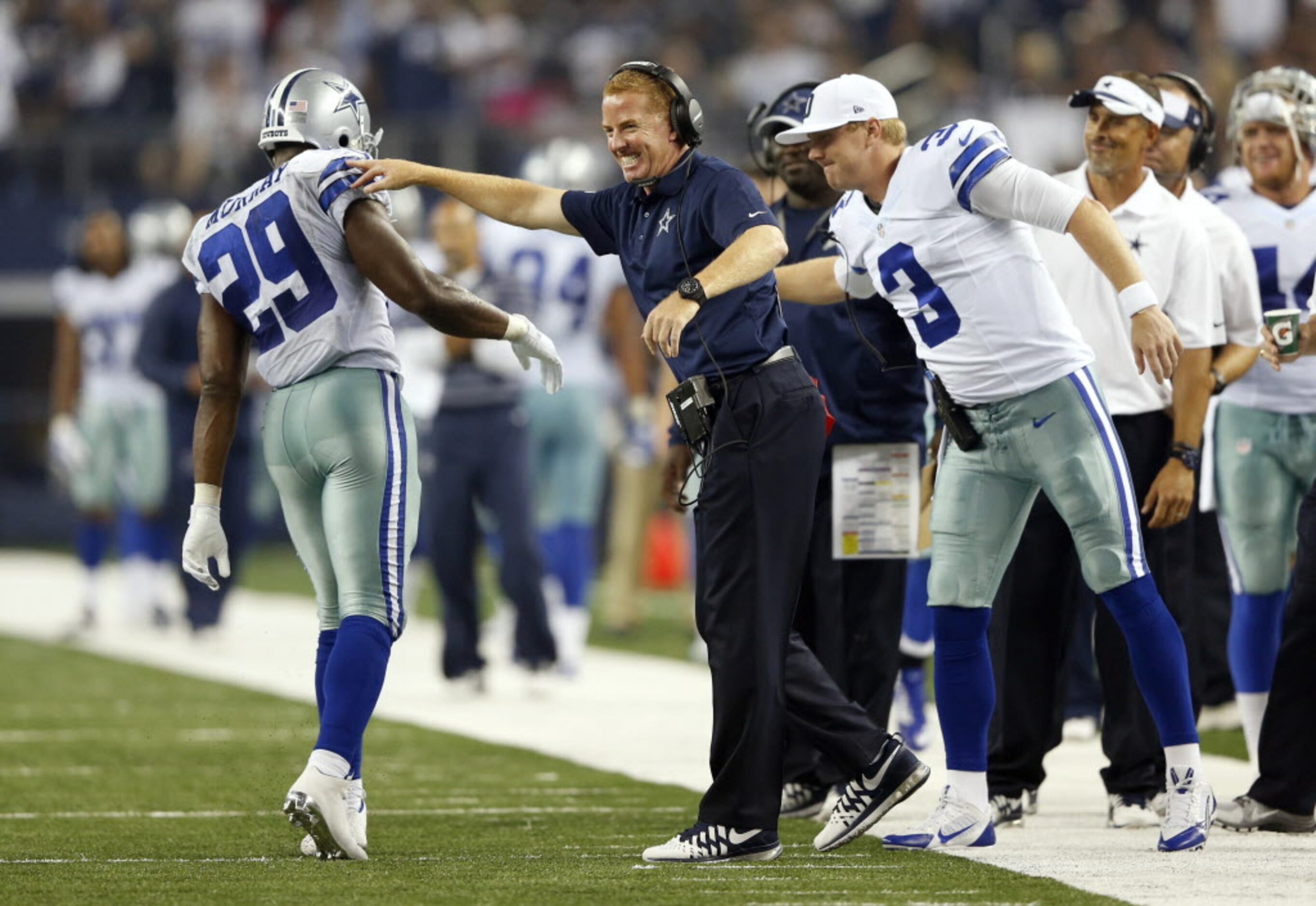 Dallas Cowboys head coach Jason Garrett celebrates with Dallas Cowboys running back DeMarco...