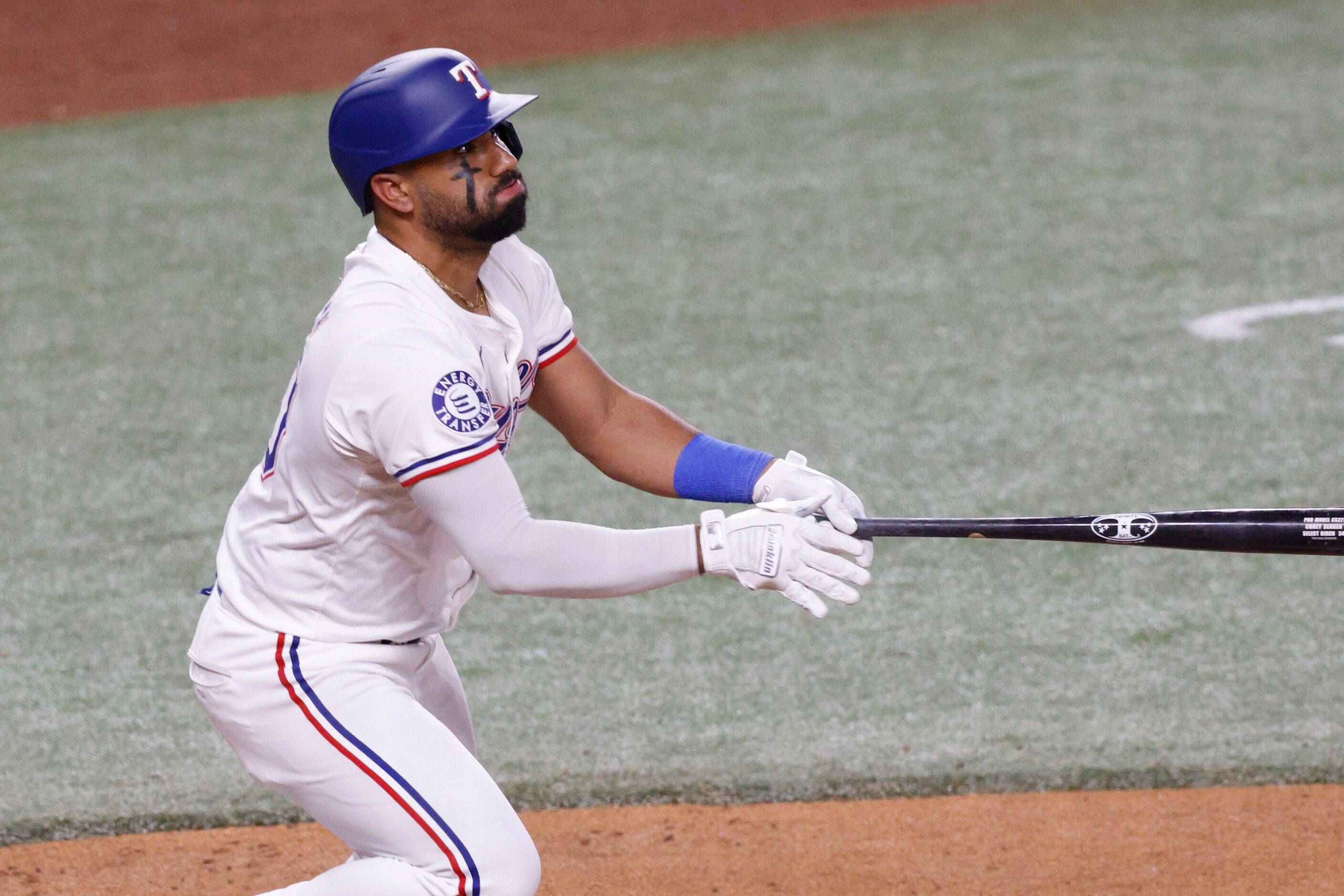 Texas Rangers second base Ezequiel Duran (20) watches his double during the second inning of...