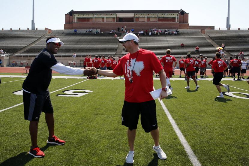 University of Houston head coach Tom Herman (right) and Texas A&M's Kevin Sumlin joined up...