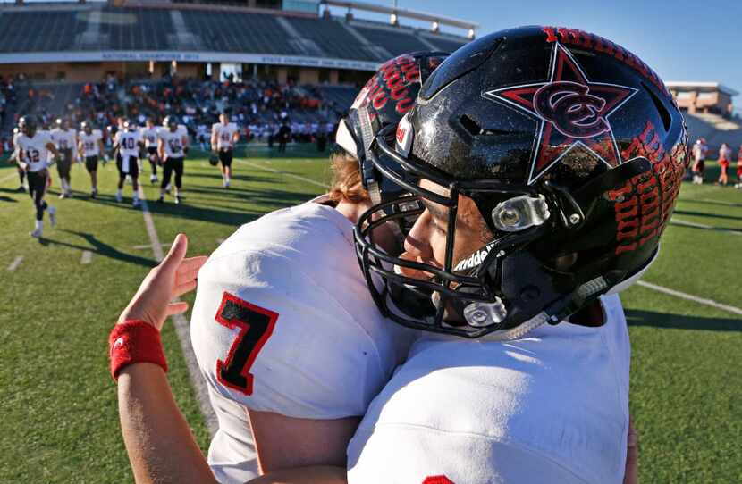 Coppell receiver Matt Dorrity (18) gets a hug from teammate Joe Fex (7) after the Coppell...
