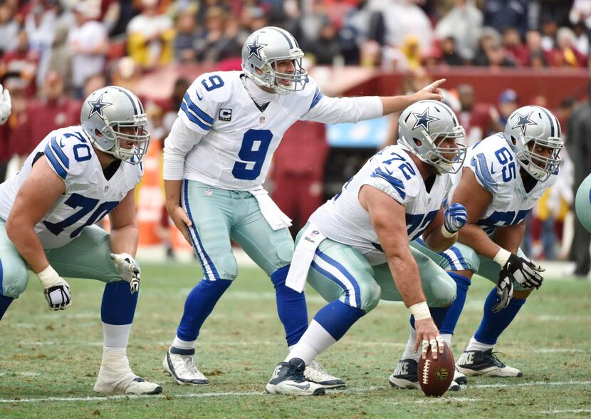 Dallas Cowboys guard Zack Martin (70), quarterback Tony Romo (9), center Travis Frederick...