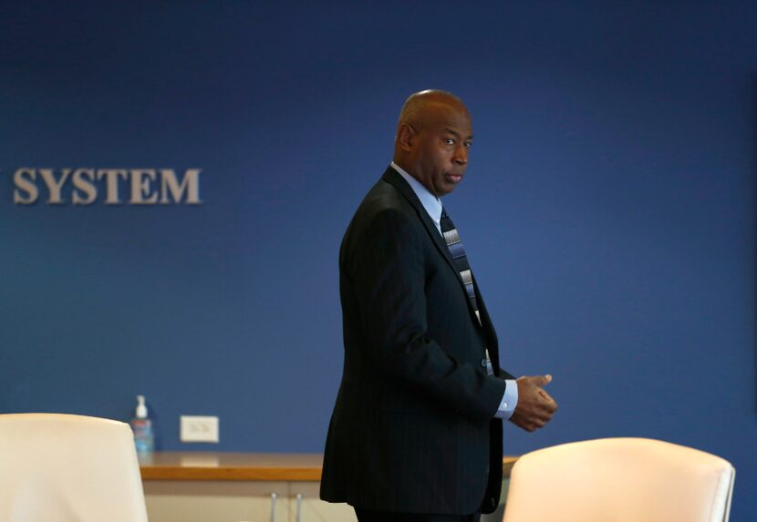 Chairman Sam Friar enters the room to take his seat for a discussion during the Board of...