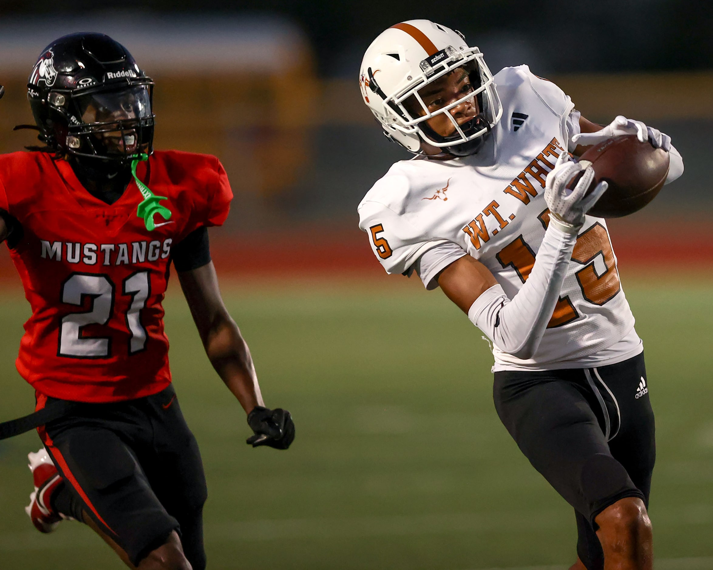 W.T. White wide receiver Lovell Neal (15) make a reception against Creekview defensive back...