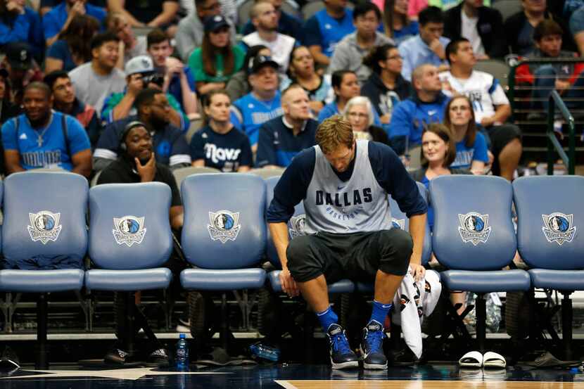 Mavericks forward Dirk Nowitzki sits in the bench during open practice at American Airlines...