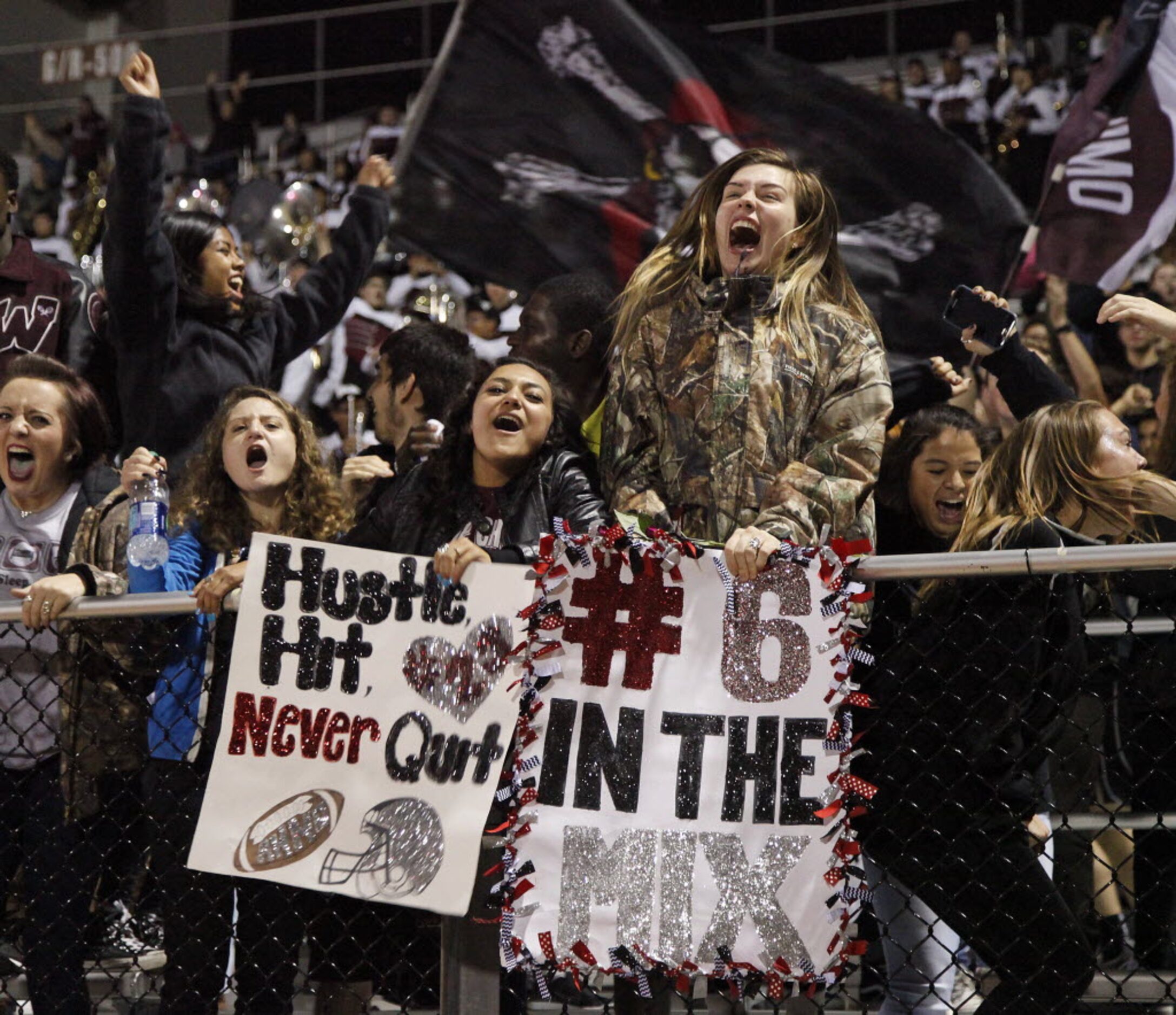 With signs of support in hand Wylie High School students Justine Rocheford (left), 17, and...