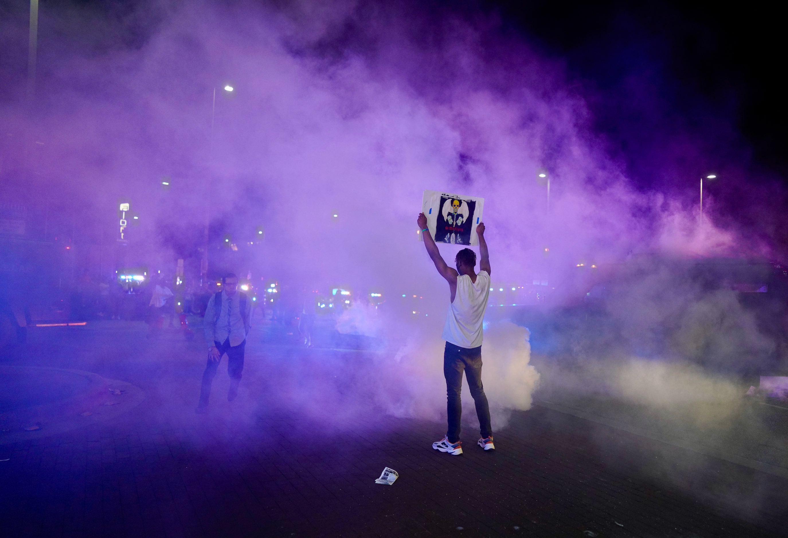 Protesters clash with Dallas police at Griffin and Young on Friday, May 29, 2020, in Dallas....