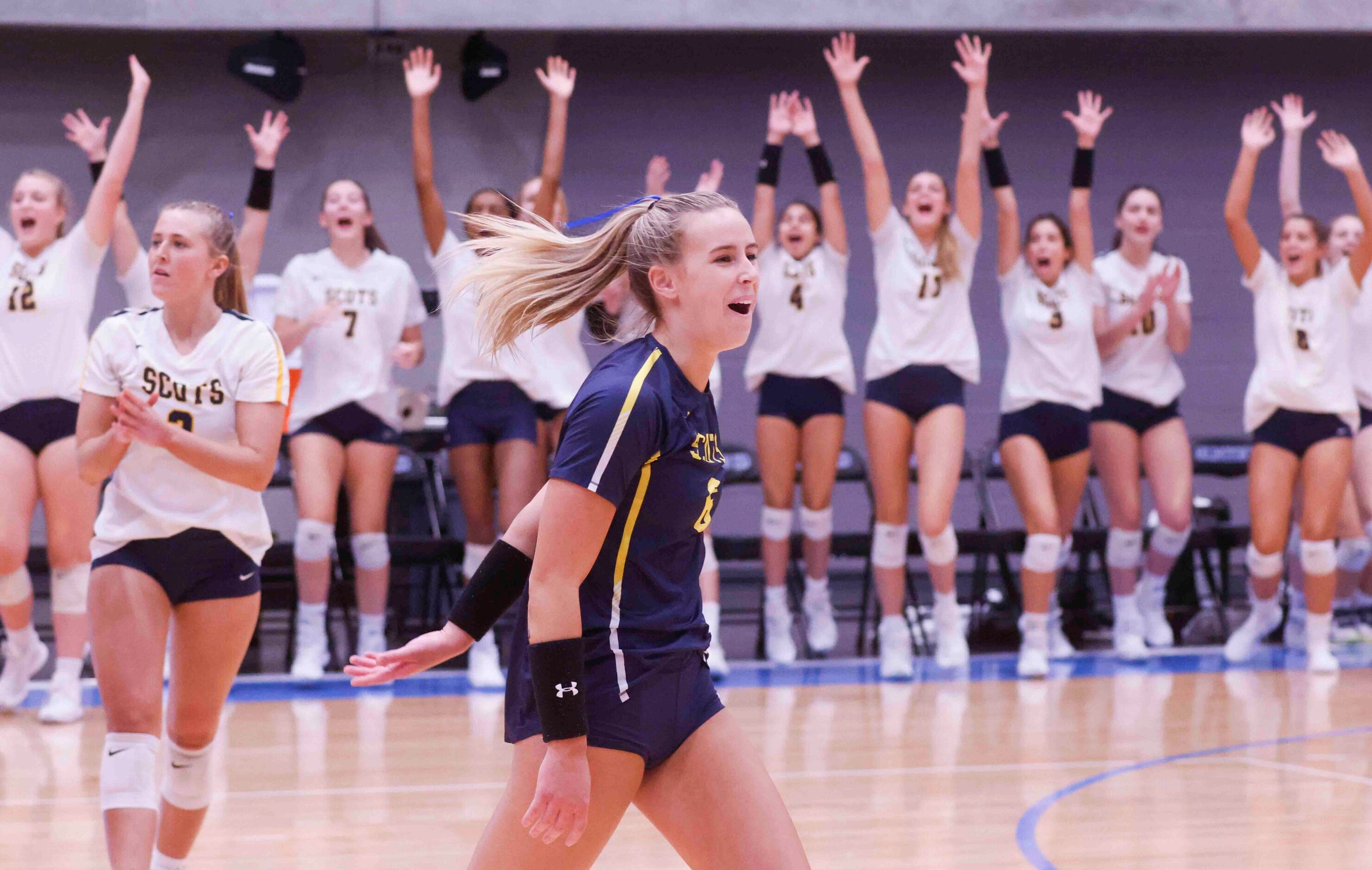 Highland Park players including Zoe Winford (6) celebrates a point against Flower Mound high...