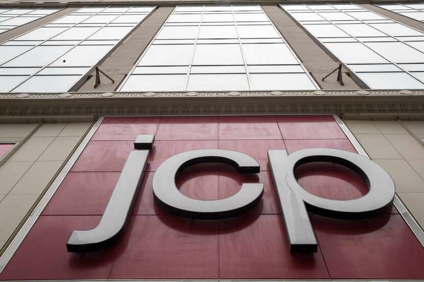 The J.C. Penney logo and stock symbol is seen hanging outside the Manhattan Mall in New York. 
