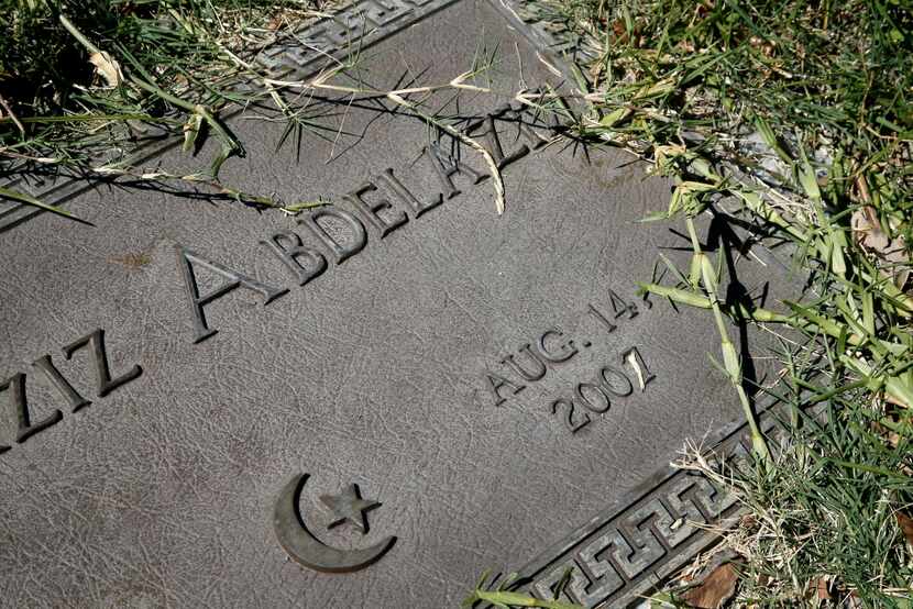 
A grave marker with a family name sits planted in the Islamic Garden, a burial site for...