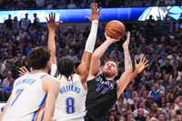Dallas Mavericks guard Luka Doncic (77) tries to shoot as Oklahoma City Thunder forward...