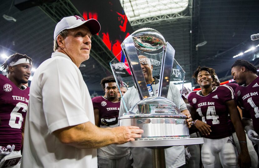 Texas A&M Aggies head coach Jimbo Fisher accepts the Southwest Classic trophy after a 24-17...