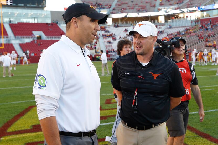 FILE - In this Sept. 28, 2017, file photo, Iowa State head coach Matt Campbell, left, talks...