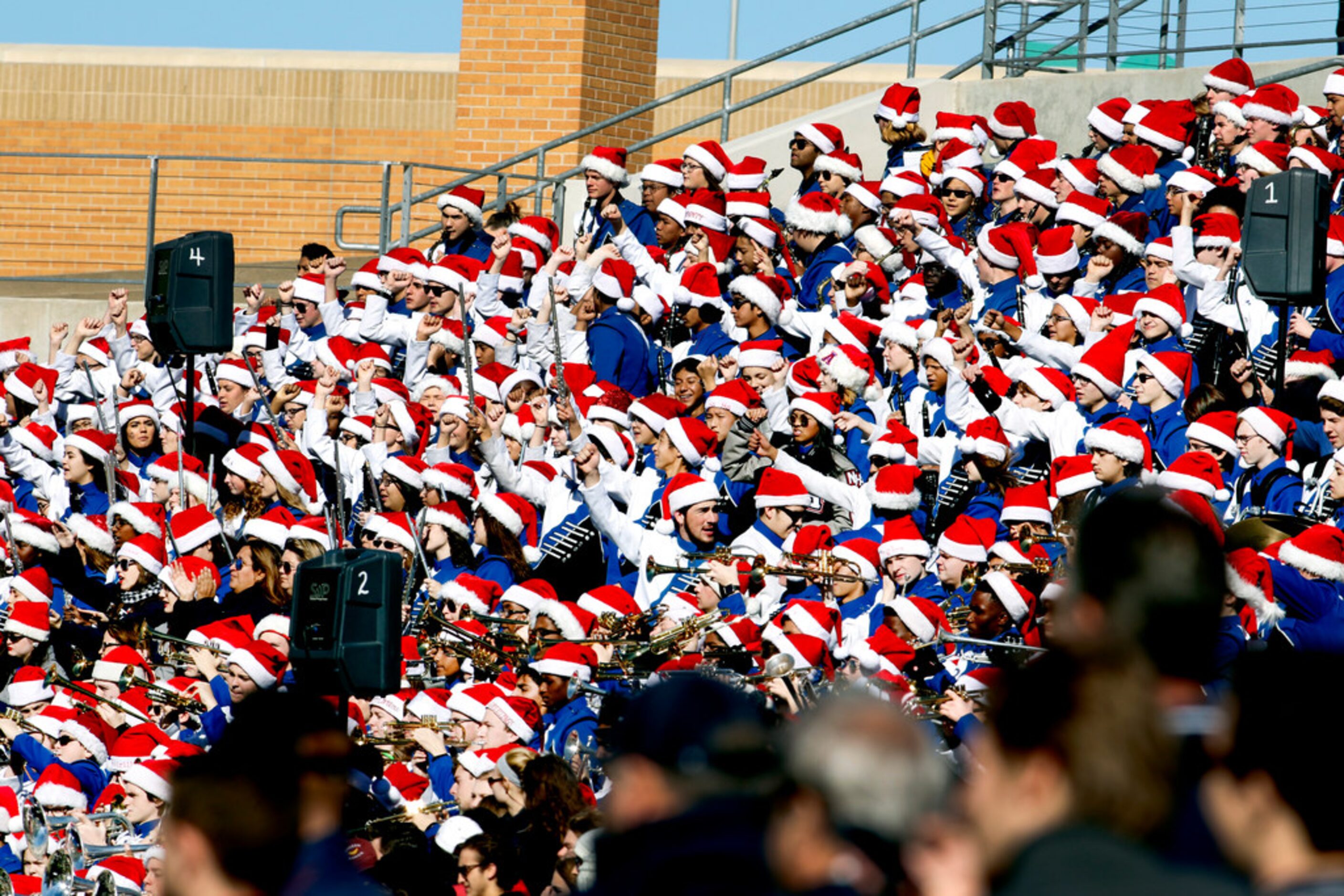 Over 700 strong, members of the Allen Eagles band, flag corps and drill team perform from...