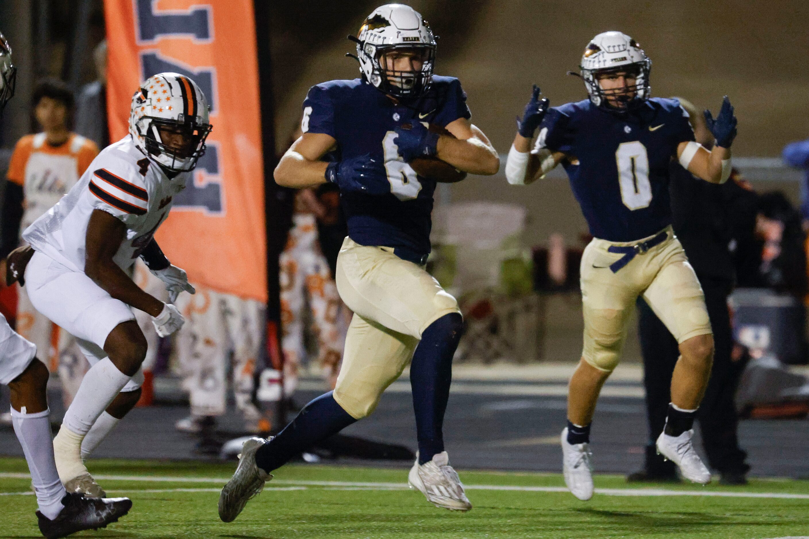 Keller High school’s Drew Roberts (6) runs to score a touchdown against Haltom High school...