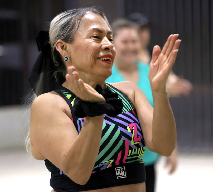 Anamelia Jaramillo applauds at the end of a session during a Zumba class held at Jubilee...