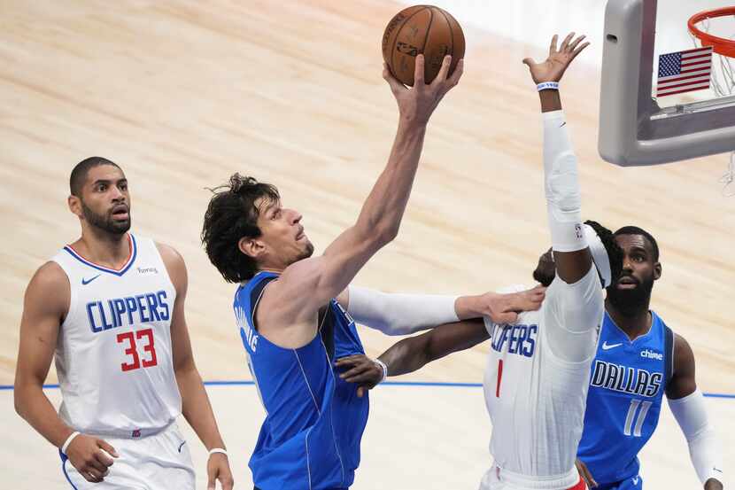 Dallas Mavericks center Boban Marjanovic (51) scores past LA Clippers guard Reggie Jackson...