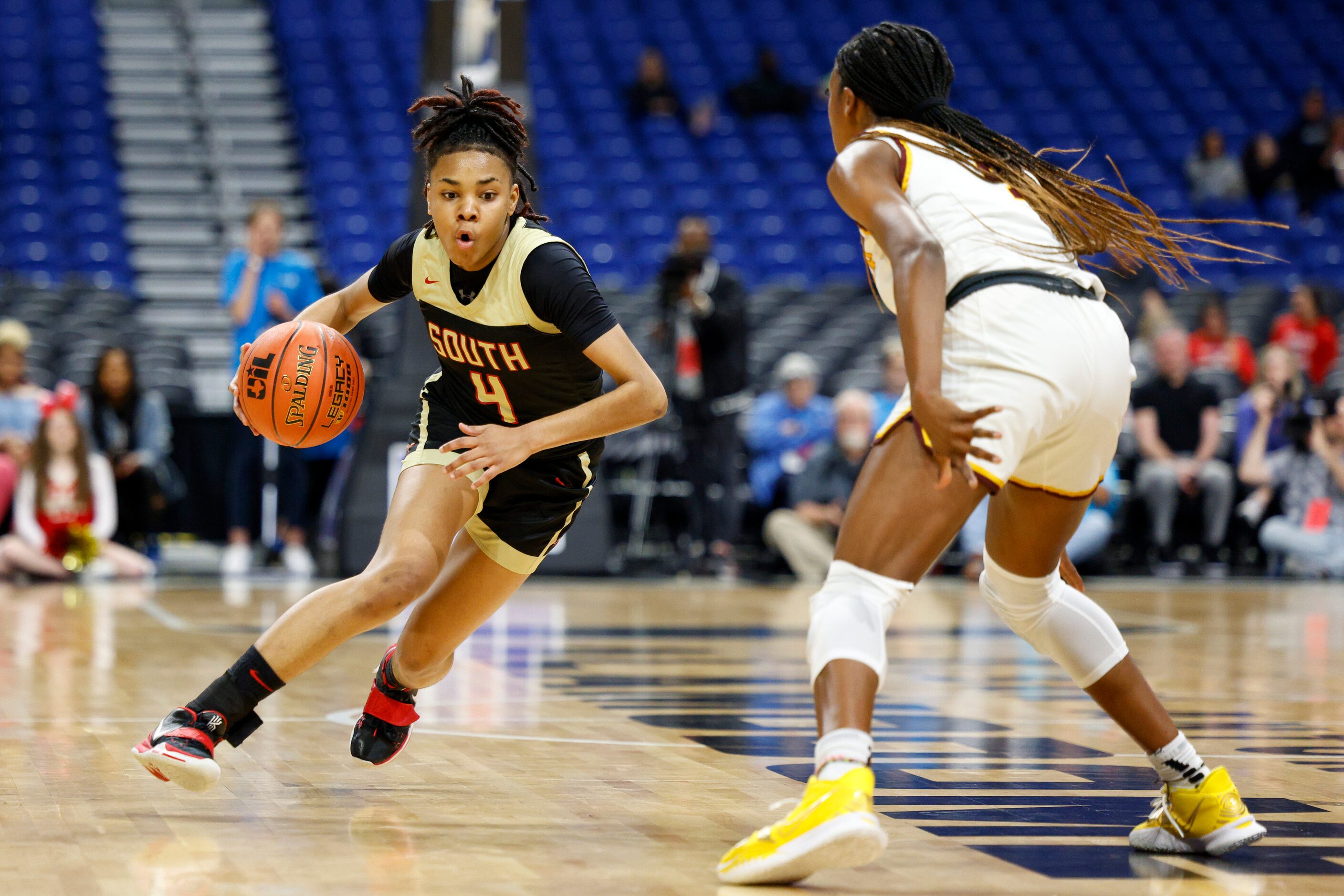 South Grand Prairie guard Joy Madison-Key (4) dribbles up the floor towards Humble Summer...