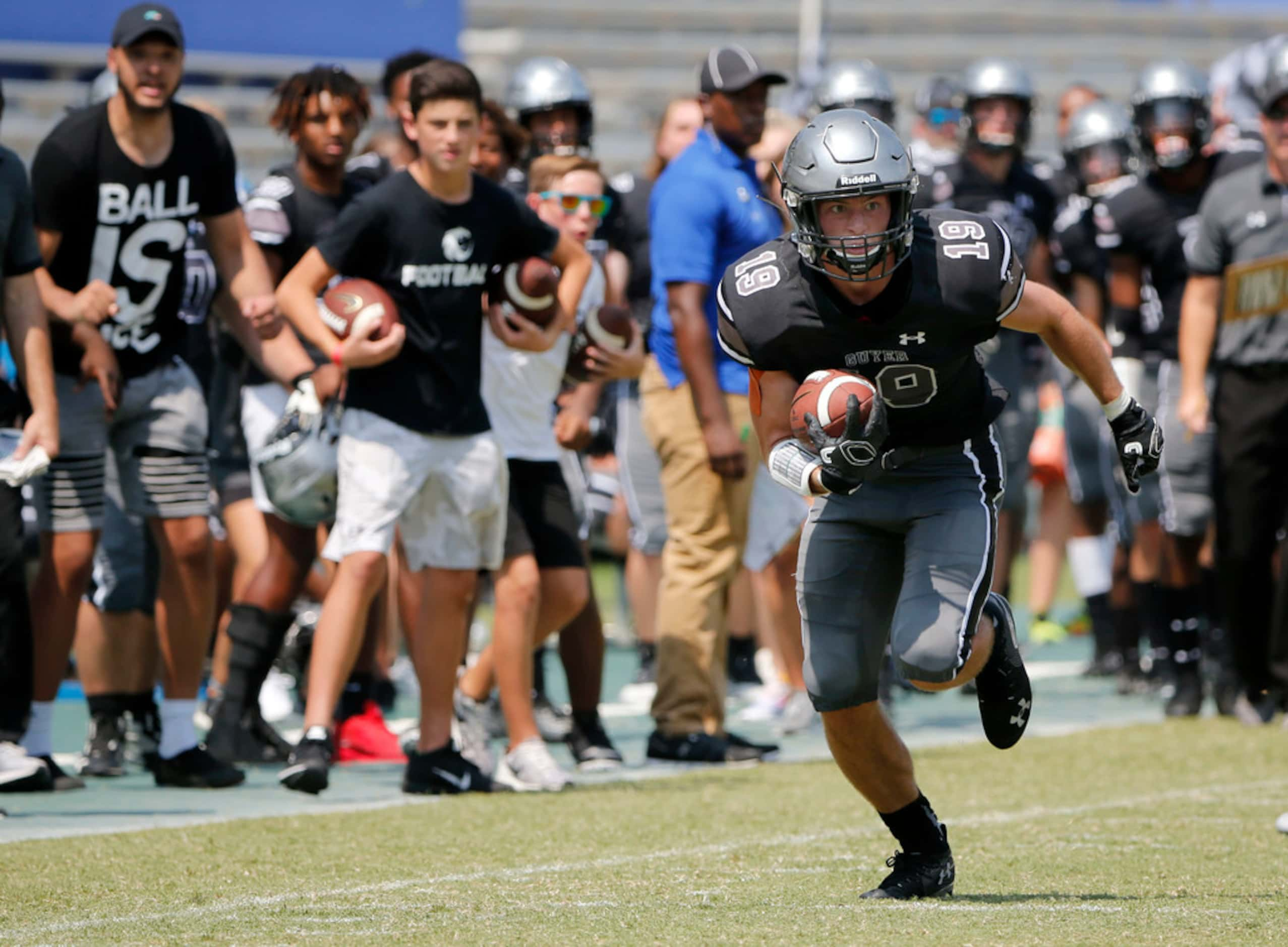 Denton Guyer receiver Seth Meador (19) runs  after a reception against Cedar Hill during the...