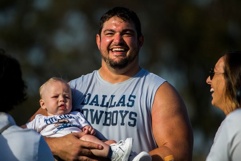 Dallas Cowboys offensive guard Zack Martin (70) greets his family after an afternoon...