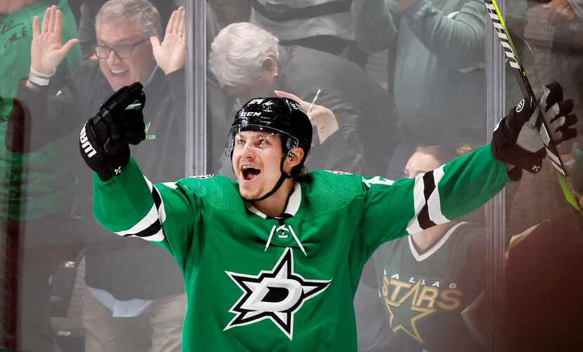 Dallas Stars Roope Hintz reacts following his third quarter hat trick against the Minnesota...
