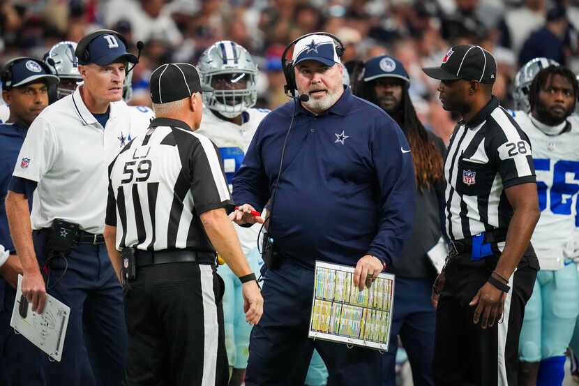 Dallas Cowboys head coach Mike McCarthy talks with officials during the second half of an...
